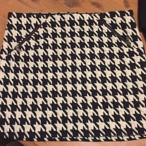 Two mini skirts. Zara and BCBG.